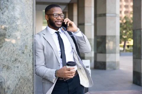 Confident Bearded Man In Glasses Using Smartphone During Coffee Break Stock Photos