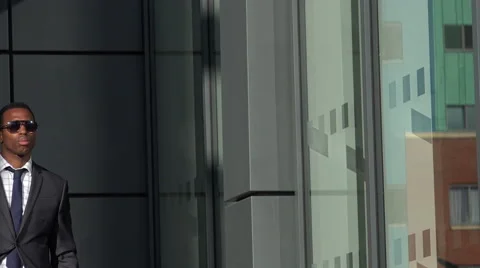 Confident black elegant businessman going to an appointment  Video stock 58330102