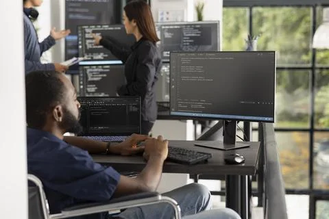 Confident black software developer in modern tech office 스톡 사진