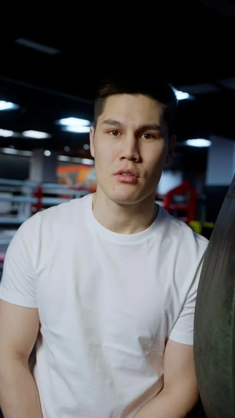 Confident Boxer Ready to Train with Punching Bag Stock Footage 261302815