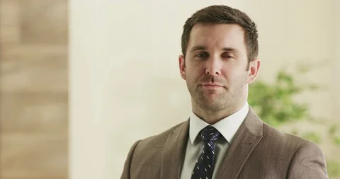 Confident business man looking into camera. Stock Footage 92220983