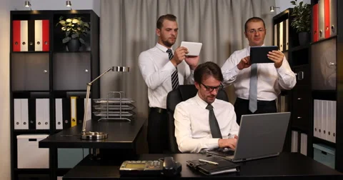 Confident Business Men Using Digital Tablet and Laptop Working Office Interior Stock Footage 67847655
