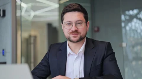 Confident Business Professional Smiles While Working On Laptop Stock Footage 330155882