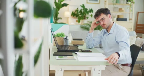 Confident Businessman Analyzes Documents 스톡 동영상 275826568