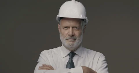 Confident businessman and engineer posing with a safety helmet Stock Footage 140403031