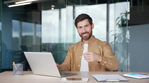Confident businessman asks to join him, beckons with inviting hand gesture  Stock Footage 295042059