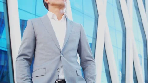 Confident businessman in front of modern office building. Financial investors Stock Footage 265051663
