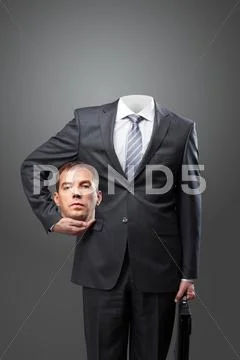 Confident businessman holding his head in hand Stock Photos
