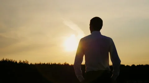 Confident businessman looking forward to the sunset. Well dressed. Concept: hope Stock Footage 66188353