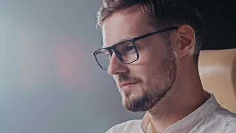 Confident businessman smiling when read funny message in corporate chat. Slow Stock Footage 256984980