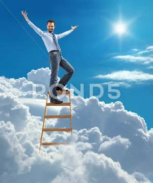 Confident businessman standing at the ladder high in the sky spread his arms Stock Photos