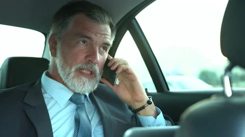 Confident Businessman talking on Phone while traveling in Business Class Car Stock Footage 162582900