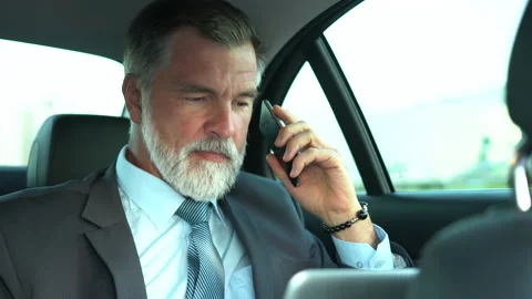 Confident Businessman talking on Phone while traveling in Business Class Car Stock Footage 162582965