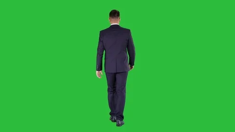 Confident businessman walking on a Green Screen, Chroma Key. Stock Footage