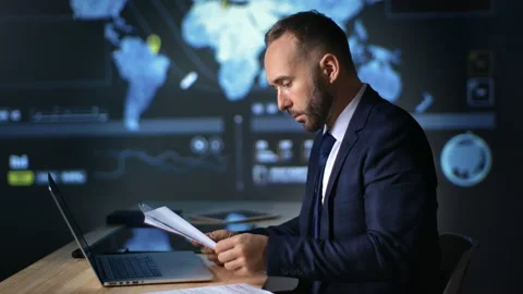 Confident businessman working paper document report and laptop hi tech office Stock Footage 165867641
