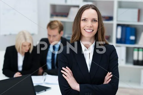 Confident businesswoman with folded arms Stock Photos