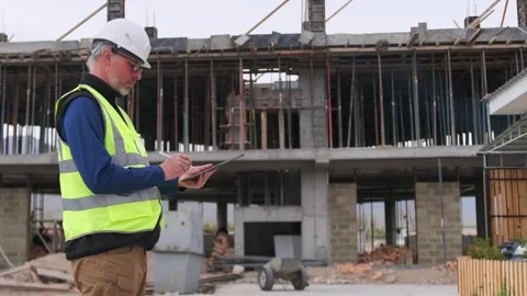 Confident caucasian engineer man with digital tablet for checking home Stock Footage 274362988