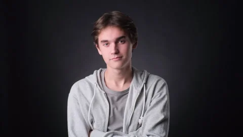 Confident Caucasian Man Looking Into Camera on black Background Stock Footage 257451550