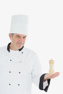 Confident chef holding salt shaker Stock Photos