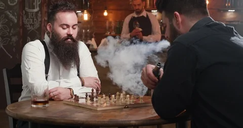 Confident chess player with beard over a game in a bar Stock Footage 103926293