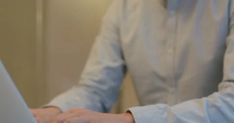 Confident Chinese businessman using laptop in office,4K Video stock 152280098