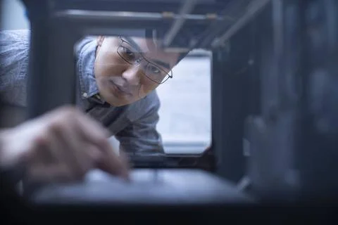 Confident Chinese designer using a 3D printer Beijing China Copyright: xLa... Foto stock