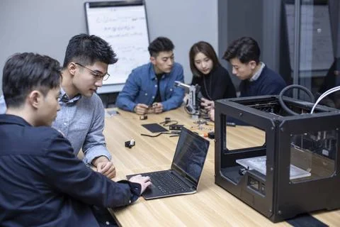 Confident Chinese designers using a 3D printer Beijing China Copyright: xL... Foto stock