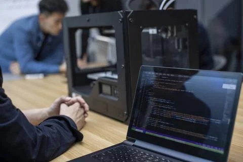  Confident Chinese designers using a 3D printer Beijing China Copyright: x... Foto stock