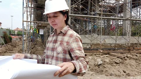 Confident construction engineer checking work at construction site. Stock Footage 118767468