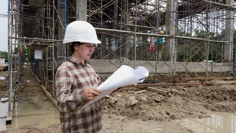 Confident construction engineer checking work at construction site. Stock Footage 125326810