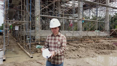 Confident construction engineer checking work at construction site. Stock Footage 129172124