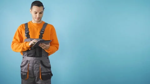 Confident construction worker or architect working on tablet Stock Footage 143899844