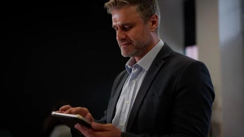 Confident data analytics new team member man browsing gadget. Businessman Stock Footage 256225309