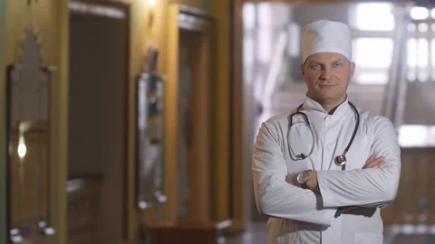 Confident doctor looking at the camera and smiling. Stock Footage 126085906