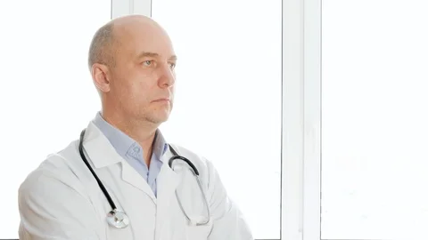 Confident doctor looking at camera Stock Footage 126475233