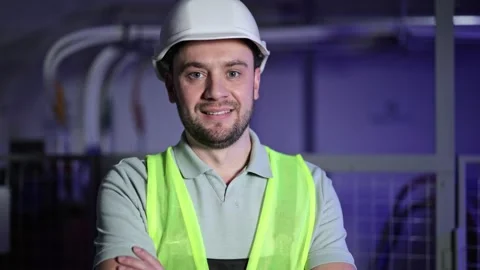 Confident Electrical Engineer in Server Room with Switchboards and Control Stock-Footage 297841819