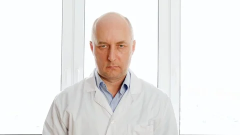 Confident engineer with crossed arms posing near window Stock Footage 126602948