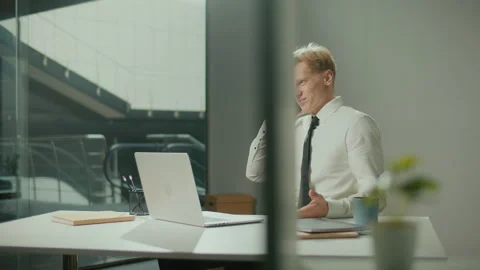 Confident Engineer with Drawings in Office Making Phone Call Discussing Project Stock Footage 239114886