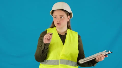 Confident engineer explains work tasks holding clipboard Stock Footage 316106905