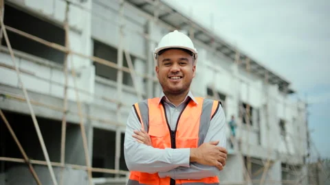 Confident engineer handsome man or architect looking forward with white safety. Stock-Footage 194521109