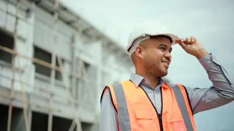 Confident engineer handsome man or architect looking forward with white safety. Stock Footage 194521140