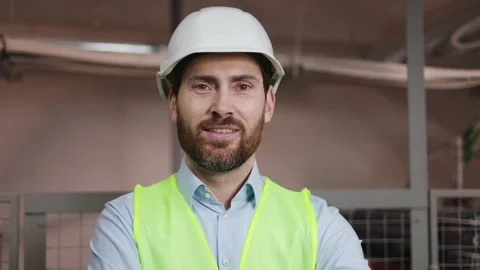 Confident engineer with safety gear in electrical substation technical room. Stock-Footage 256143265