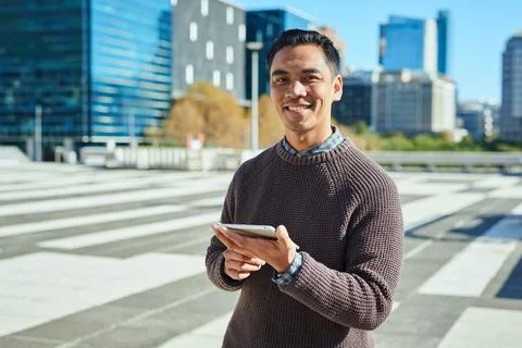 Confident Entrepreneur Using Mobile Device in Modern Urban Environment Stock Photos