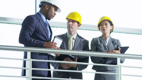 Confident ethnic property developer showing new building to prospective business Stock Footage 74656589