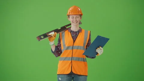 Confident Female Builder ,with Bubble Level Tool on Shoulder and Clipboard Stock Footage 224913337