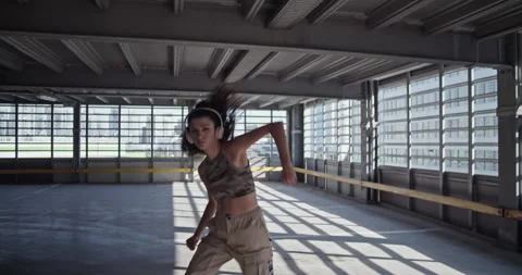 Confident female dancer walking towards camera Stock Footage 213645814