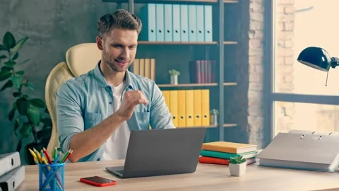 Confident focused freelance worker sit table work laptop prepare annual report Stock Footage 162031221