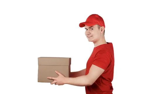Confident guy from the delivery service in a cap with a parcel in his hands 스톡 사진