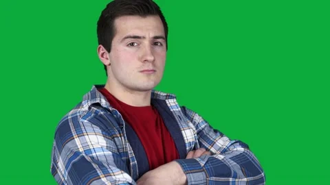 Confident guy looking at camera on green screen Stock Footage 158817883