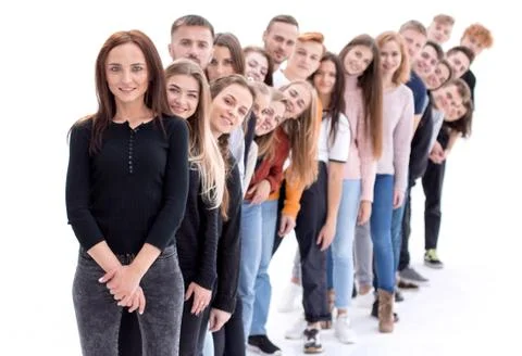 Confident guy standing first in the column of young people Stock Photos